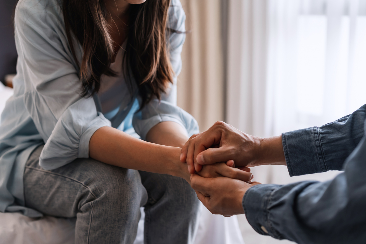 Therapist offering compassionate grief counseling support to a client.