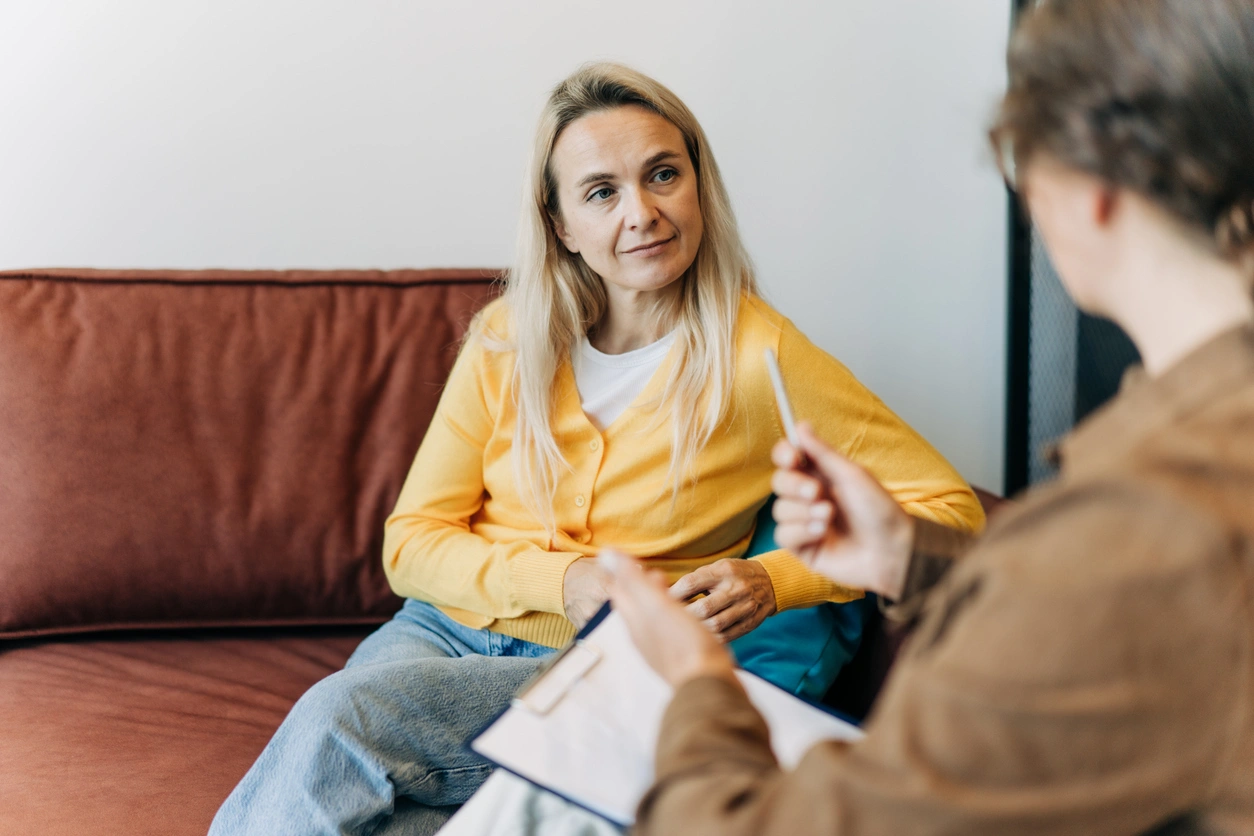 Woman consulting with a psychologist about grief in an office setting