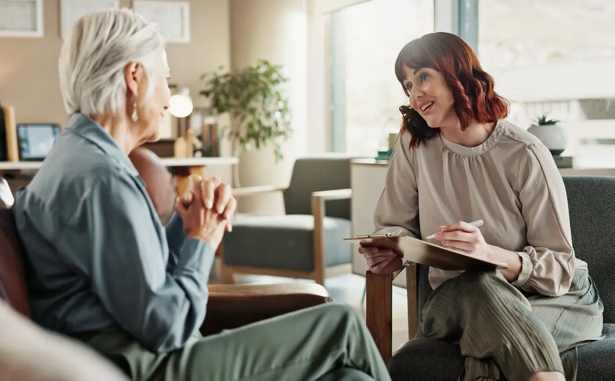 How to deal with grief after loss: a woman receiving compassionate support during a counseling session